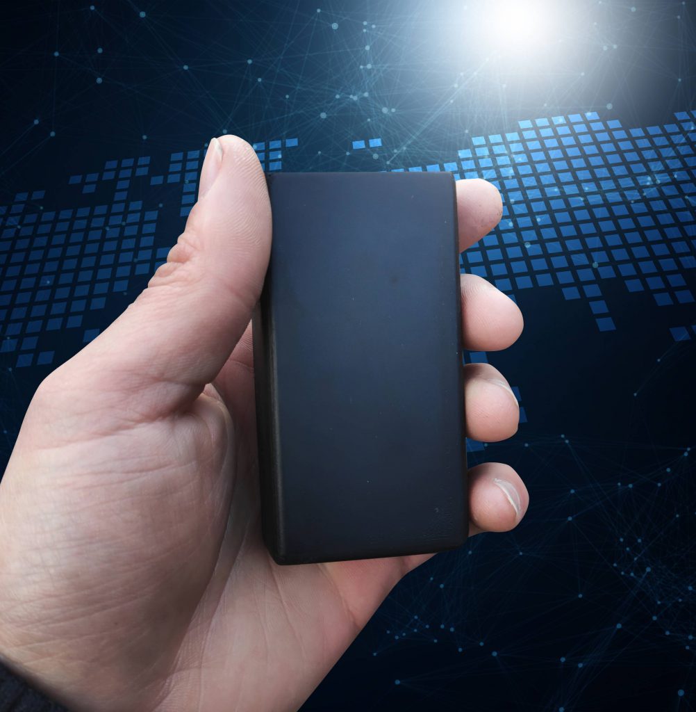 Holding a Solid GPS Tracker