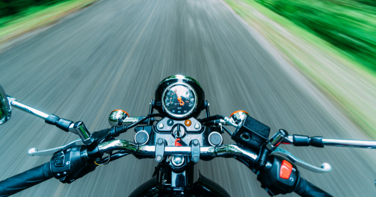 Speeding down a road on a motorcycle