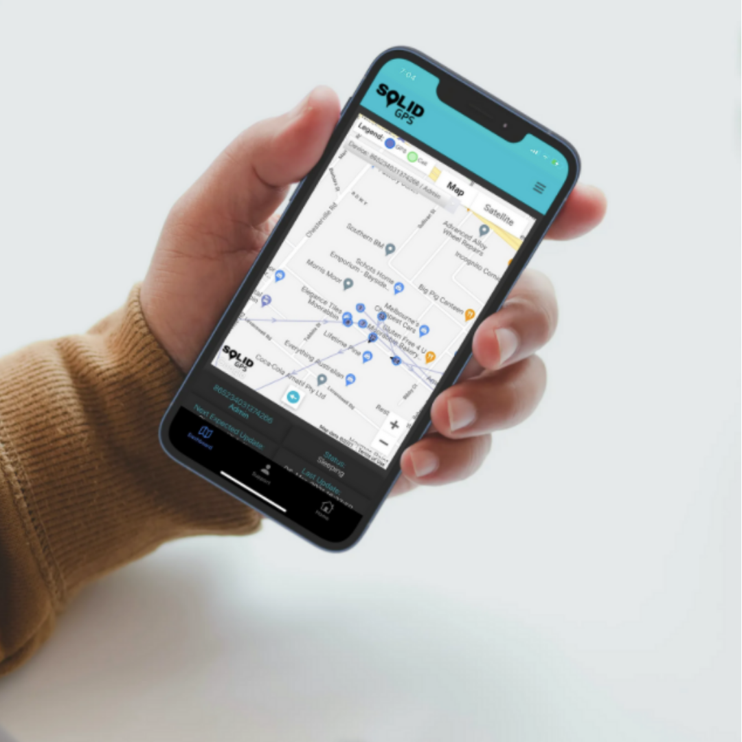 A hand holding a phone A hand holding a phone showing a Solid GPS location tracking