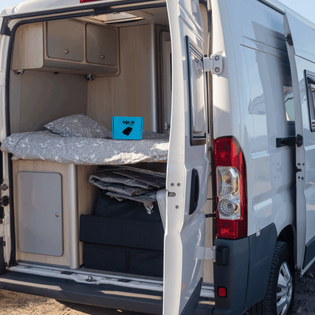 Solid GPS tracker mounted inside the back of a vehicle