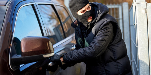 Car Thief Stealing a Vehicle Car Thief Stealing a Vehicle